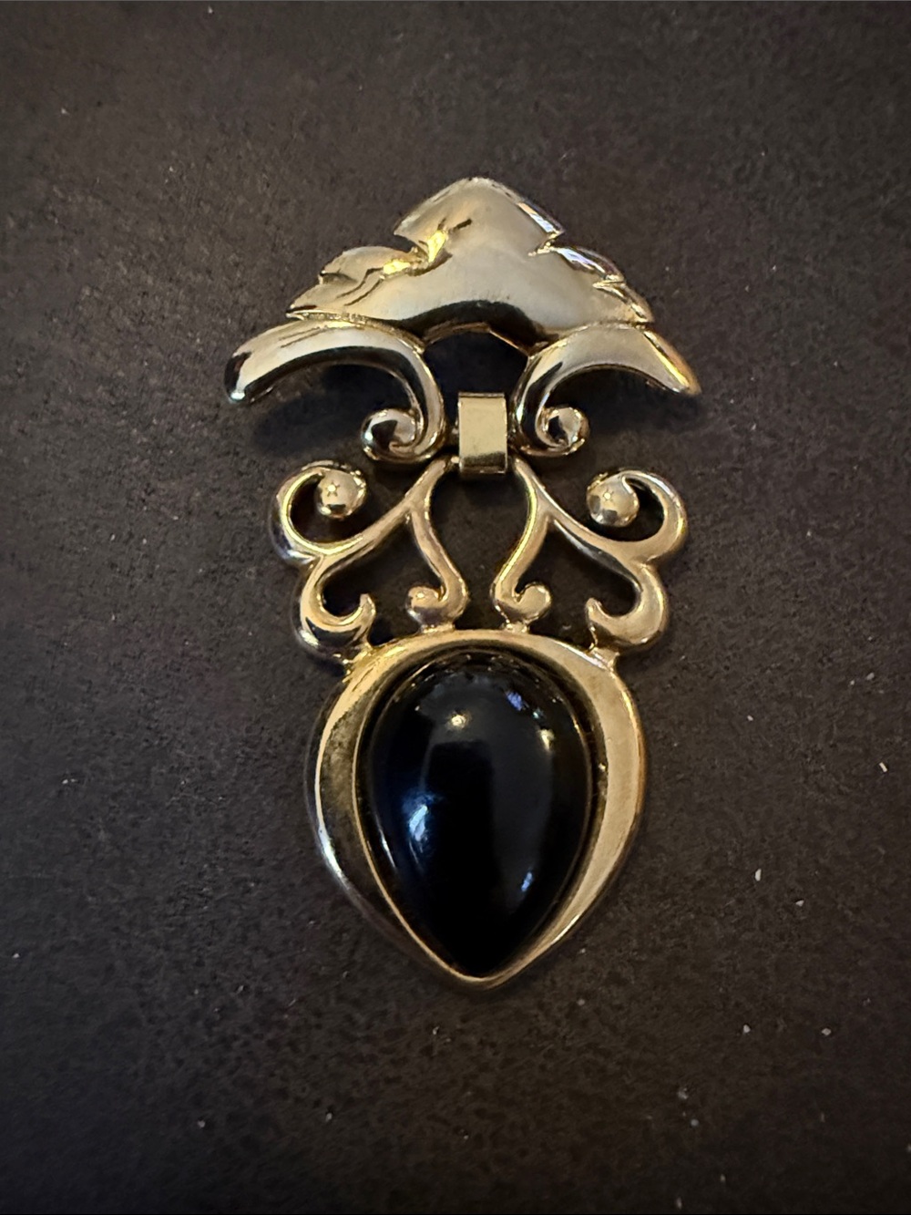 Gold-Tone Brooch with Black Teardrop Stone
